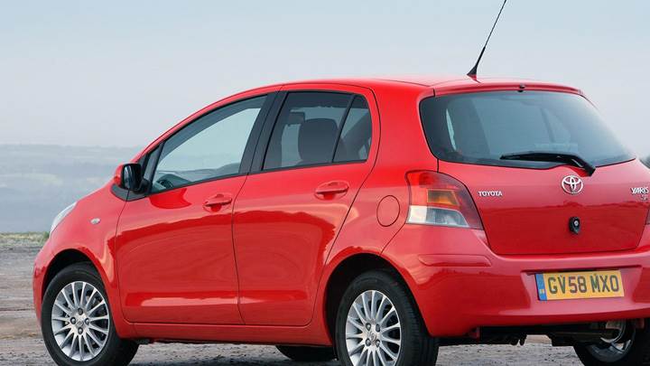 Toyota Yaris Near Sea In Red Back Side Pose